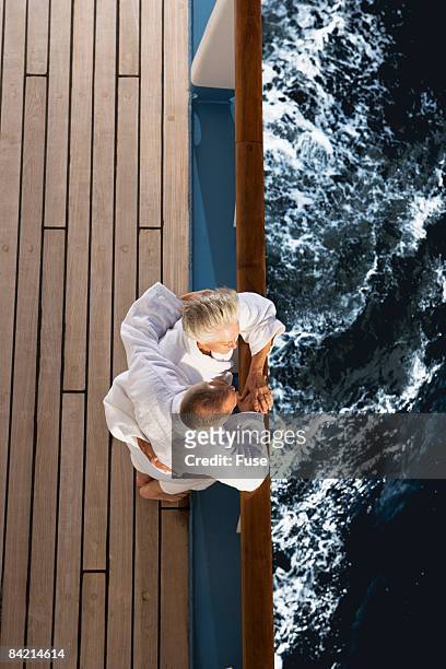 couple looking at ocean from ship - couple on cruise ship stock pictures, royalty-free photos & images