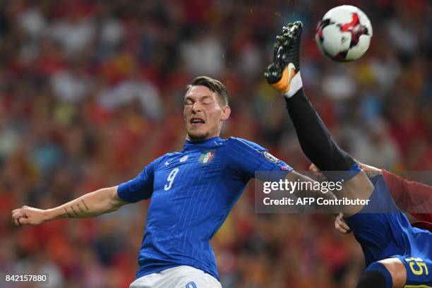 Italy's forward Andrea Belotti vies with Spain's defender Sergio Ramos during the World Cup 2018 qualifier football match between Spain and Italy at...