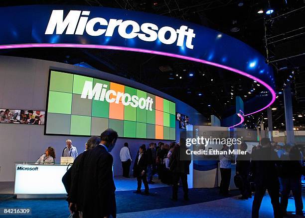 Visitors walk pass the Microsoft Corp. Booth at the 2009 International Consumer Electronics Show at the Las Vegas Convention Center January 8, 2009...