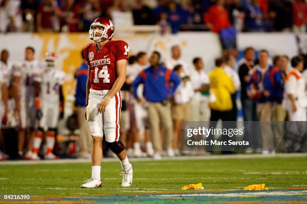 Quarterback Sam Bradford of the Oklahoma Sooners reacts after Oklahoma was called fror a holding penalty which negated a first down against the...