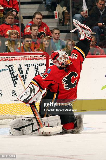 Miikka Kiprusoff of the Calgary Flames makes a glove save against the New York Islanders on January 8, 2009 at Pengrowth Saddledome in Calgary,...