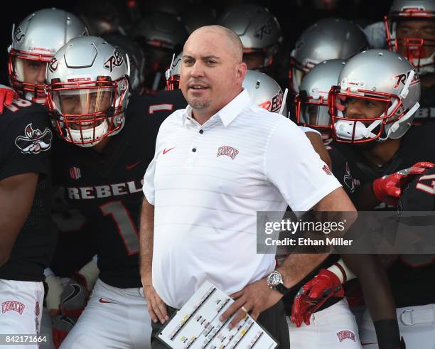 Head coach Tony Sanchez of the UNLV Rebels prepares to take the field with his players before their game against the Howard Bison at Sam Boyd Stadium...