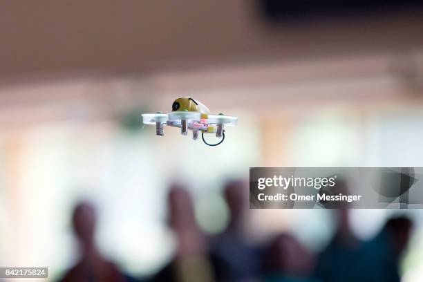 Miniature INDUCTRIX FPV quadcopter racing drone is seen on flight at the Dronemasters 2017 convention on September 3, 2017 in Berlin, Germany. The...