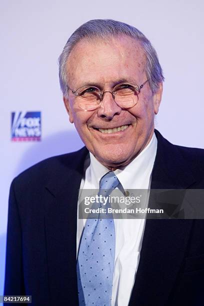 Former Secretary of Defense Donald Rumsfeld poses on the red carpet upon arrival at a salute to FOX News Channel's Brit Hume on January 8, 2009 in...