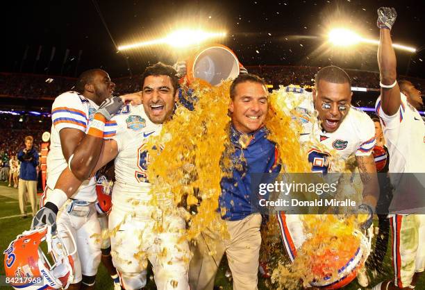 Head coach Urban Meyer of the Florida Gators gets gatorade dumped on him by his teammates towards the end of the game against the Oklahoma Sooners in...