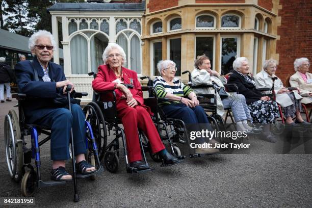 World War II veterans who worked at Bletchley Park and its outstations gather for a group picture in front of Bletchley Park Mansion during an annual...
