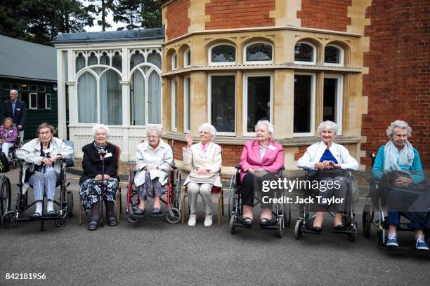 World War II veterans who worked at Bletchley Park and its outstations gather for a group picture in front of Bletchley Park Mansion during an annual...