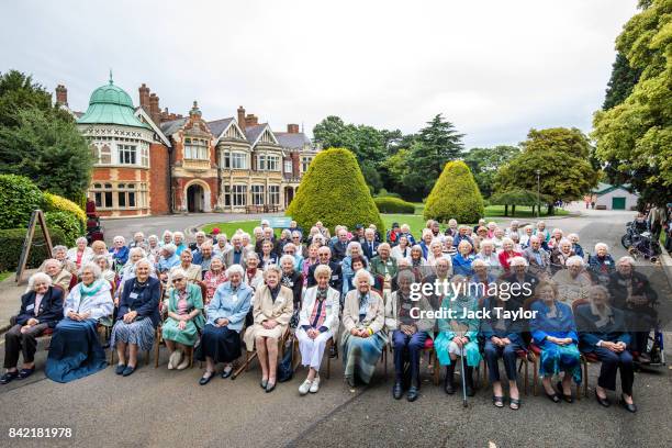 World War II veterans who worked at Bletchley Park and its outstations pose for a picture in front of Bletchley Park Mansion during an annual reunion...