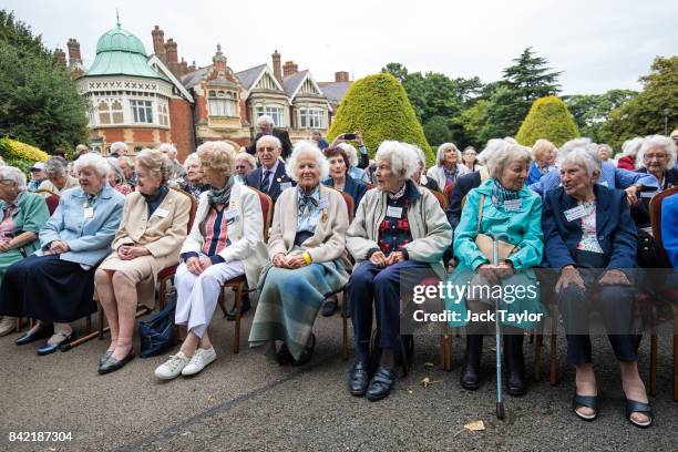 World War II veterans who worked at Bletchley Park and its outstations gather for a group picture in front of Bletchley Park Mansion during an annual...
