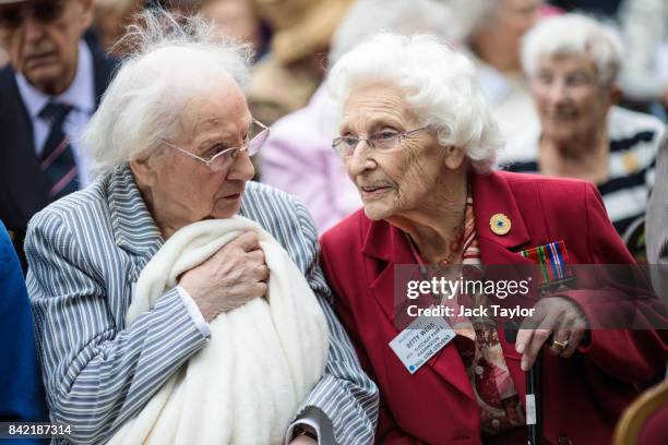 World War II veteran from the Auxiliary Territorial Service Betty Webb joins other veterans who worked at Bletchley Park and its outstations pose for...