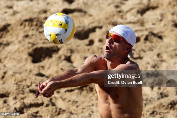 Jake Gibb bumps the ball during his match against Phil Delhausser and Nick Lucena in the quarterfinal round at the AVP Championships in Chicago - Day...