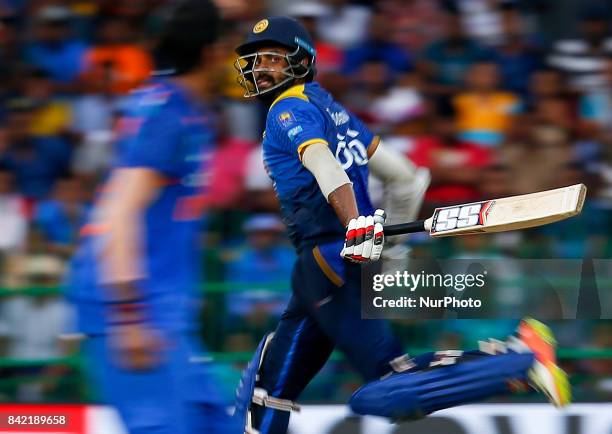 Sri Lankan cricketer Lahiru Thirimanne runs between the wickets during the 5th and final One Day International cricket match between Sri Lanka and...