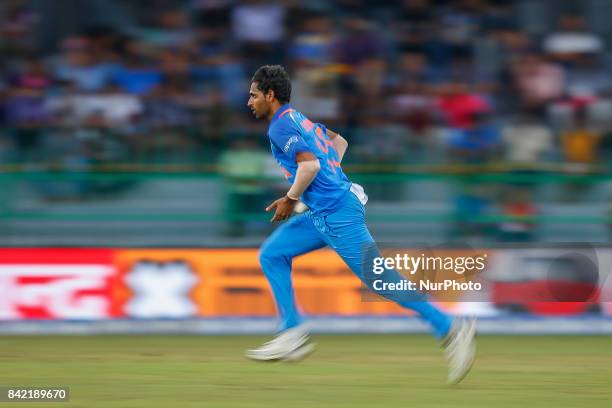 Indian cricketer Bhuvneshwar Kumar delivers a ball during the 5th and final One Day International cricket match between Sri Lanka and India at the R...