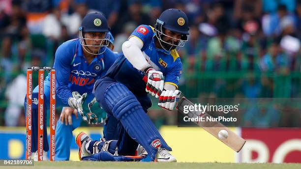 Sri Lankan cricketer Lahiru Thirimanne plays a shot during the 5th and final One Day International cricket match between Sri Lanka and India at the R...