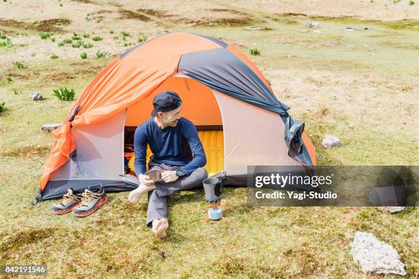 backpacker hiking in nature - japanese tents stock pictures, royalty-free photos & images