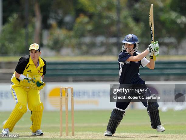 Sarah Edwards of the Spirit plays a shot as Fury Wicketkeeper Jenny Wallace looks on during the WNCL match between the Victoria Spirit and the...