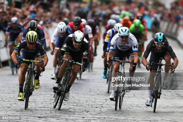 Caleb Ewen of Team Orica Scott wins a sprint finish from Edvald Boasson-Hagen, Alexander Kristoff and Elia Viviani on stage one during the 14th Tour...