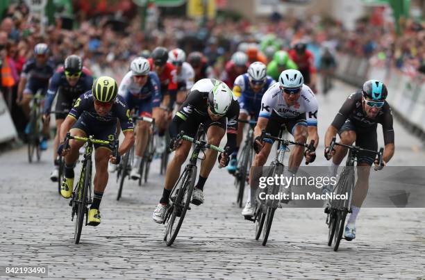 Caleb Ewen of Team Orica Scott wins a sprint finish from Edvald Boasson-Hagen, Alexander Kristoff and Elia Viviani on stage one during the 14th Tour...