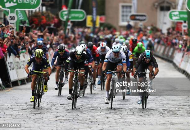 Caleb Ewen of Team Orica Scott wins a sprint finish from Edvald Boasson-Hagen, Alexander Kristoff and Elia Viviani on stage one during the 14th Tour...