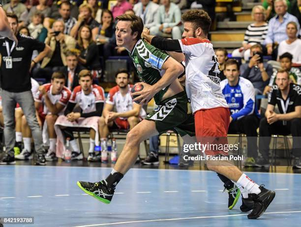 Hans Lindberg of Fuechse Berlin and Pascal Durak of the Eulen Ludwigshafen during the game between Fuechse Berlin and the Eulen Ludwigshafen on...