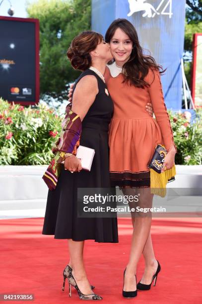 Ariane Ascaride and Anais Demoustier walk the red carpet ahead of the 'The House By The Sea ' screening during the 74th Venice Film Festival at Sala...