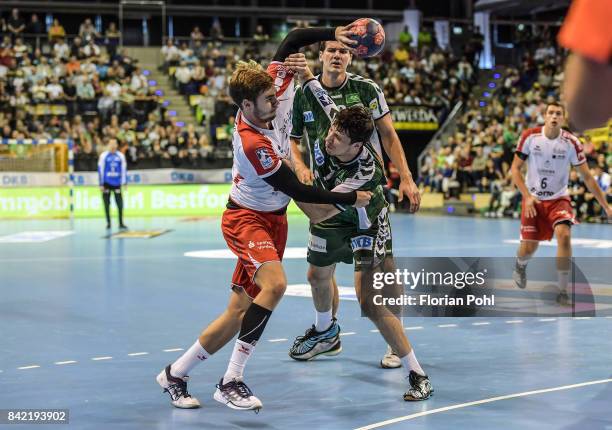 Alexander Falk of the Eulen Ludwigshafen, Erik Schmidt and Kevin Struck of Fuechse Berlin during the game between Fuechse Berlin and the Eulen...