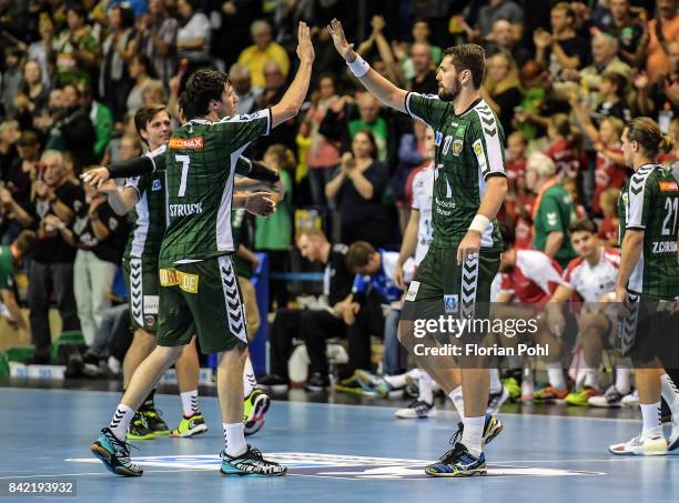 Kevin Struck and Jakov Gojun of Fuechse Berlin celebrate the win after the game between Fuechse Berlin and the Eulen Ludwigshafen on September 3,...