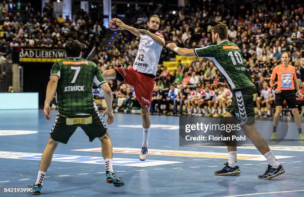 Kevin Struck of Fuechse Berlin, Patrick Weber of the Eulen Ludwigshafen and Jakov Gojun of Fuechse Berlin during the game between Fuechse Berlin and...