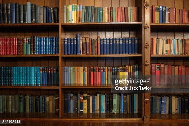 Books sit on shelves in The Library in Bletchley Park Mansion on September 3, 2017 in Milton Keynes, England. Bletchley Park was the Government Code...