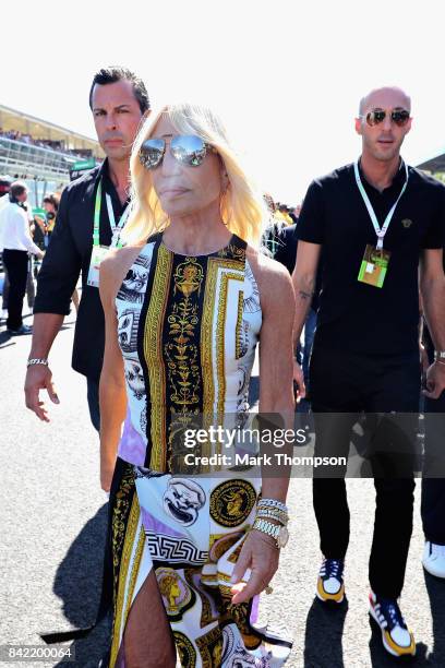 Fashion designer Donatella Versace walks on the grid before the Formula One Grand Prix of Italy at Autodromo di Monza on September 3, 2017 in Monza,...