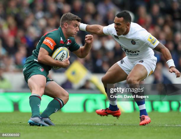 George Ford of Leicester is tackled by Kahn Fotuali'i during the Aviva Premiership match between Leicester Tigers and Bath Rugby at Welford Road on...