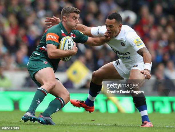 George Ford of Leicester is tackled by Kahn Fotuali'i during the Aviva Premiership match between Leicester Tigers and Bath Rugby at Welford Road on...