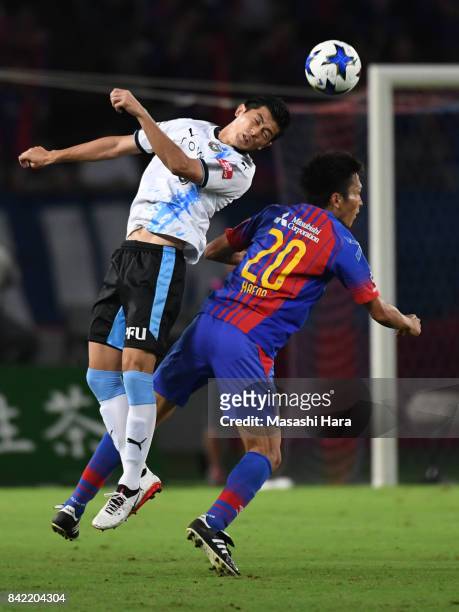 Shogo Taniguchi of Kawasaki Frontale and Ryoichi Maeda of FC Tokyo compete for the ball during the J.League Levain Cup quarter final second leg match...