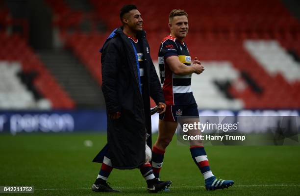 Tusi Pisi of Bristol Rugby and Ian Madigan of Bristol Rugby share a joke at the final whistle during the Greene King IPA Championship match between...