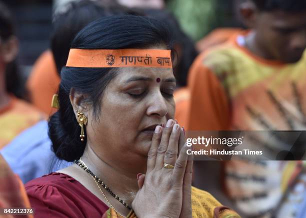 Devotees during the tenth day immersion of Ganesha idols at Sukhrali pond, on September 3, 2017 in Gurgaon, India. Several devotees, who brought the...