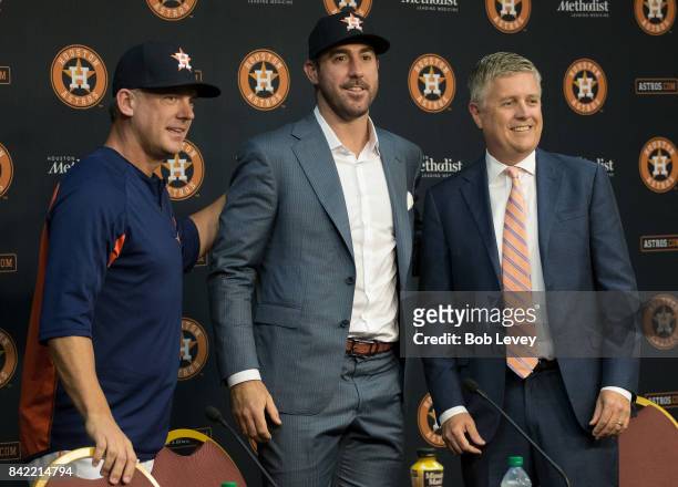 Justin Verlander , center, along with manager A.J. Hinch, left, and general manager Jeff Luhnow during a press conference to officially introduce...