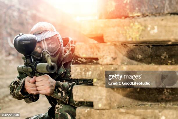 paintball player - paintball stock pictures, royalty-free photos & images