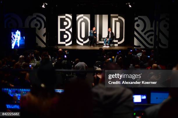 Host Thierry-Maxime Loriot and designer Viktor Horsting speak at a panel talk ahead of the 'Viktor & Rolf' fashion show during Bread & Butter by...