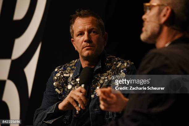 Host Thierry-Maxime Loriot and designer Viktor Horsting speak at a panel talk ahead of the 'Viktor & Rolf' fashion show during Bread & Butter by...