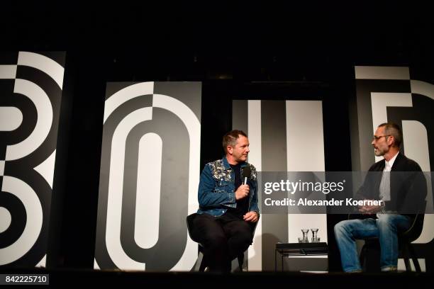 Host Thierry-Maxime Loriot and designer Viktor Horsting speak at a panel talk ahead of the 'Viktor & Rolf' fashion show during Bread & Butter by...