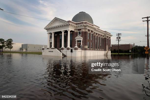 Floodwater surrounds the First Baptist Church after torrential rains pounded Southeast Texas following Hurricane and Tropical Storm Harvey causing...