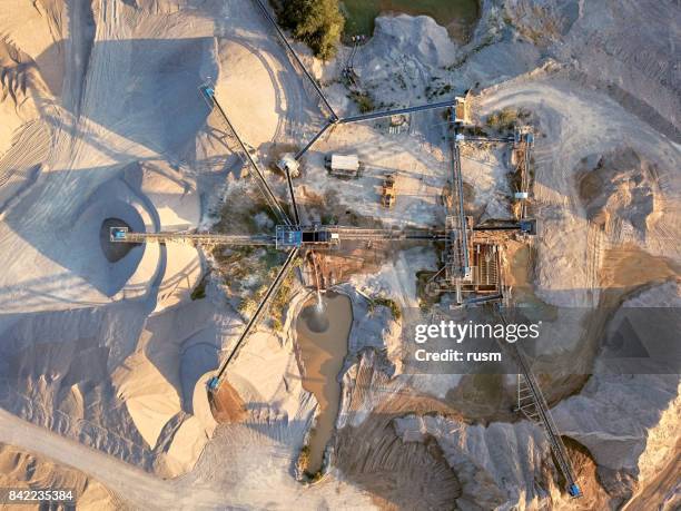 aerial view of crushed stone quarry machine - sand plants stock pictures, royalty-free photos & images