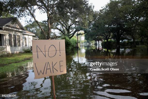 Street is covered with floodwater after torrential rains pounded Southeast Texas following Hurricane and Tropical Storm Harvey causing widespread...