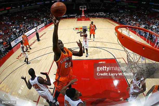 David Monds of the Albuquerque Thunderbirds goes up for a shot over Patrick Sanders and Marvin Phillips of the Iowa Energy during the D-League game...