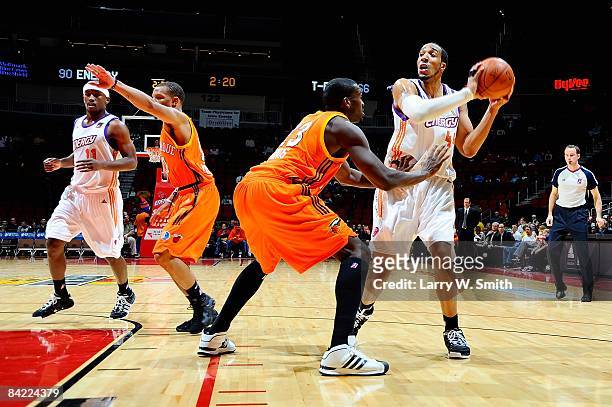 Courtney Sims of the Iowa Energy looks to pass over David Monds of the Albuquerque Thunderbirds during the D-League game on December 4, 2008 at Wells...