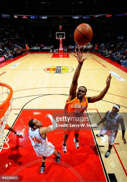 Steven Allen of the Albuquerque Thunderbirds puts a shot up over Courtney Sims and Curtis Stinson of the Iowa Energy during the D-League game on...