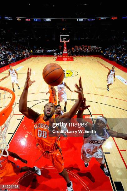 Steven Allen of the Albuquerque Thunderbirds goes up for a rebound over Curtis Stinson of the Iowa Energy during the D-League game on December 4,...