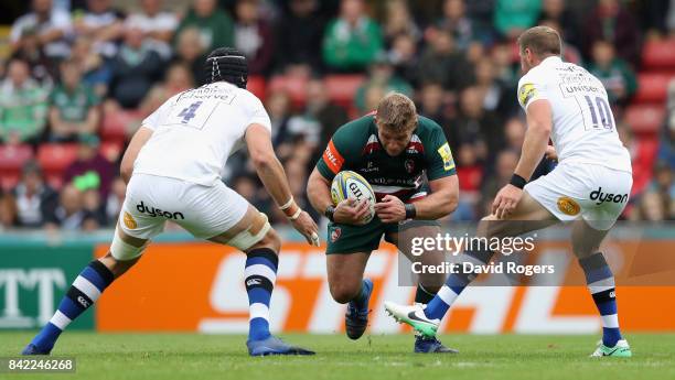 Tom Youngs of Leicester Tigers takes on Luke Charteris and Rhys Priestland during the Aviva Premiership match between Leicester Tigers and Bath Rugby...