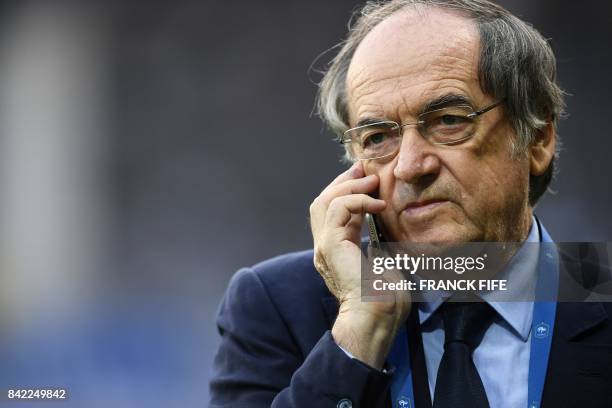 President of the French Football Federation , Noel Le Graet speaks on his mobile phone before the FIFA World Cup 2018 qualifying football match...