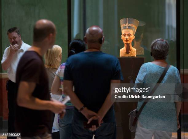 The New Museum on the Berlin Museum Island. The photo shows tourists at the world famous, approx 3000 years old bust, of the pharao godess Nefertiti.